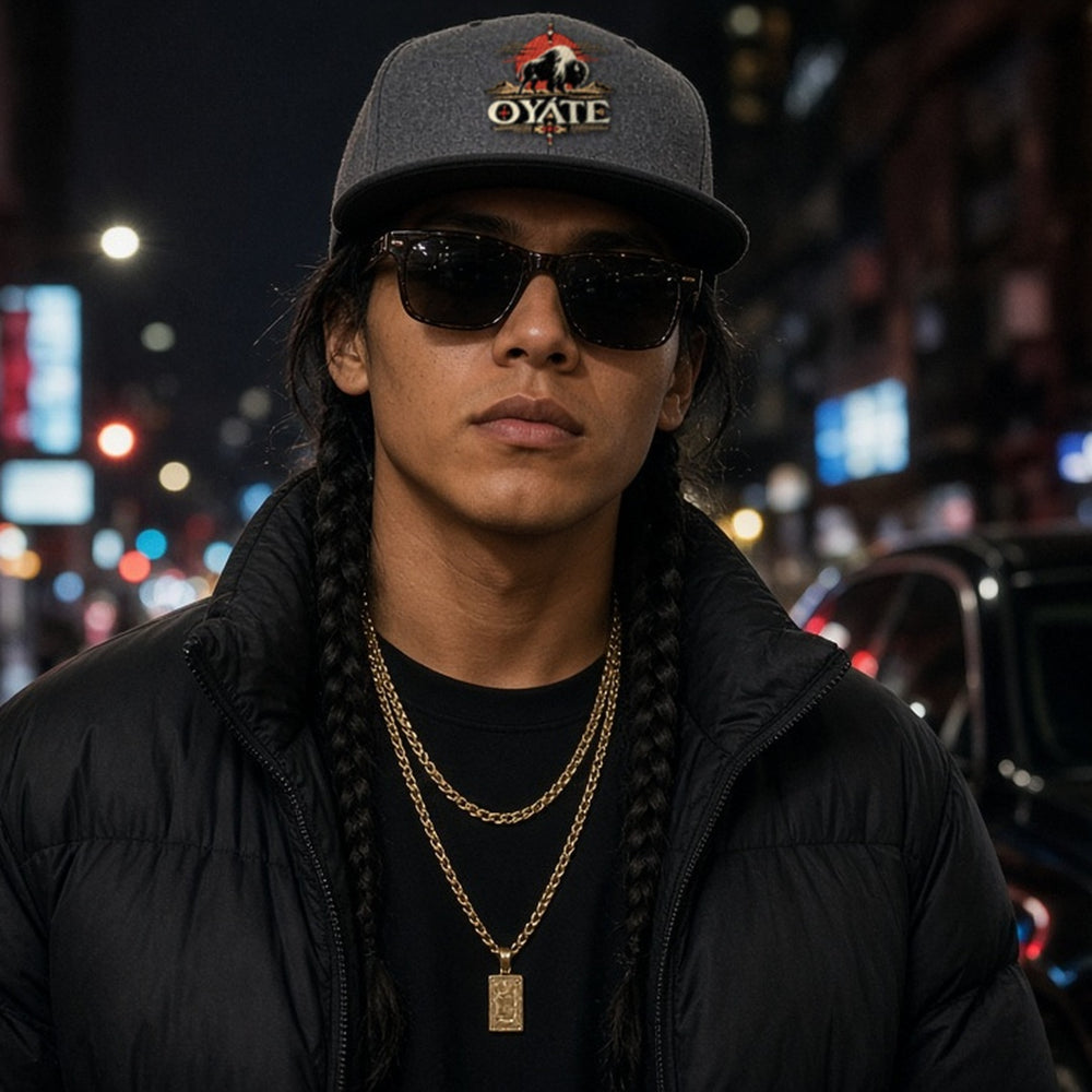 Model wearing the OYÁTE Dark Buffalo v2 embroidered snapback in charcoal gray